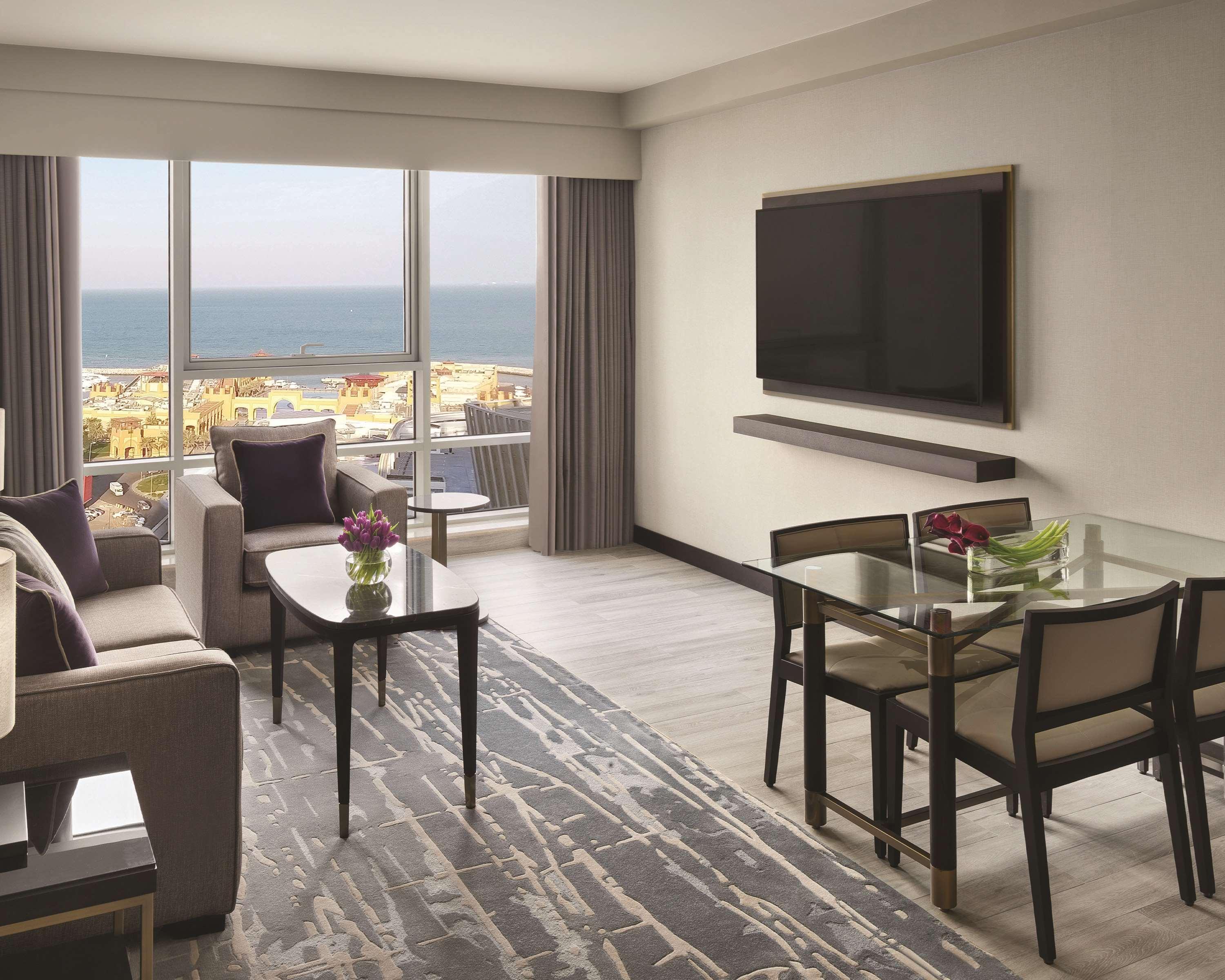 Hyatt Regency Al Kout Mall Кувейт Екстериор снимка A living room in a suite at the Hilton San Diego Bayfront
